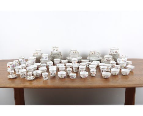 A LARGE DRESDEN TEA SERVICE 19th century and later, the white ground with scrolling gilt rims and polychrome floral decoratio