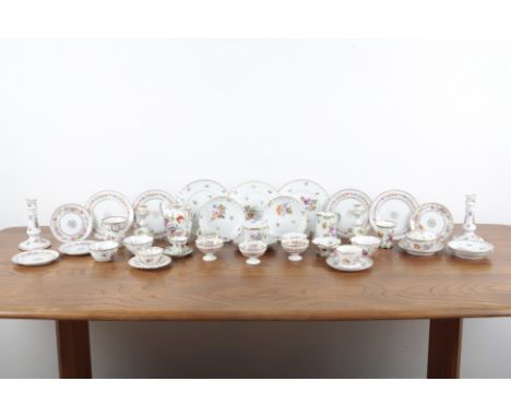 A LARGE COLLECTION OF DRESDEN CERAMICS 19th century and later, including two pairs of candlesticks, several teacups and sauce