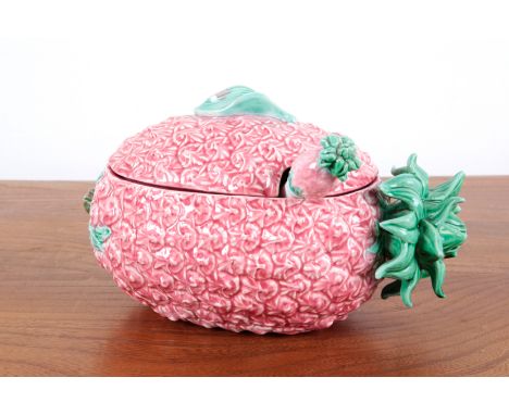 A LARGE PINK CERAMIC PINEAPPLE TUREEN 20th century, the lidded naturalistic tureen with a conforming serving spoon, 28cm long
