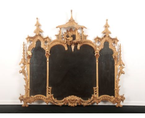 A GILTWOOD MIRROR OF CHINESE CHIPPENDALE DESIGN OF GEORGE III STYLE 20th century, the three shaped plates within a foliate an
