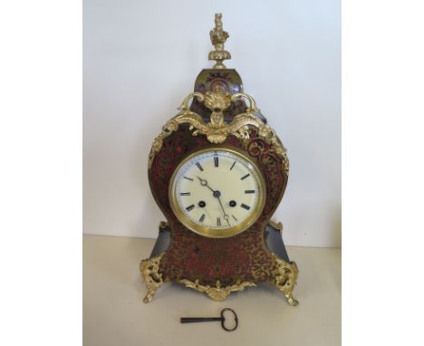 A 19th Century French boulle balloon mantel clock with gilt metal mounts, the white enamel 4 inch dial inscribed Hry Marc A P