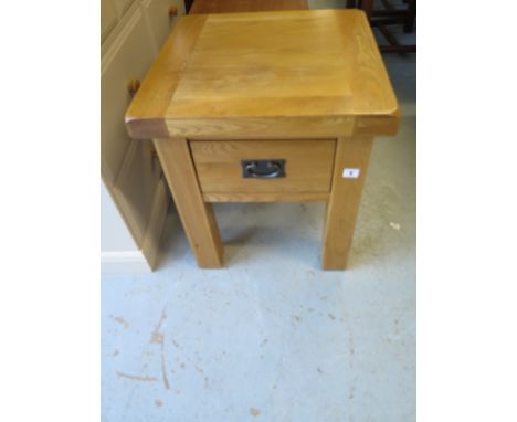 A modern oak lamp table with a drawer 50cm square 