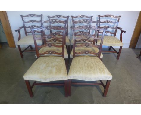 A good quality set of eight Georgian style mahogany dining chairs, with wide seats and carved ladder backs, includes two carv