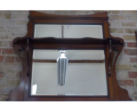 A mahogany framed arts and crafts style over mantle mirror, approximately 96cm high, 122cm wide, with some light wear otherwi
