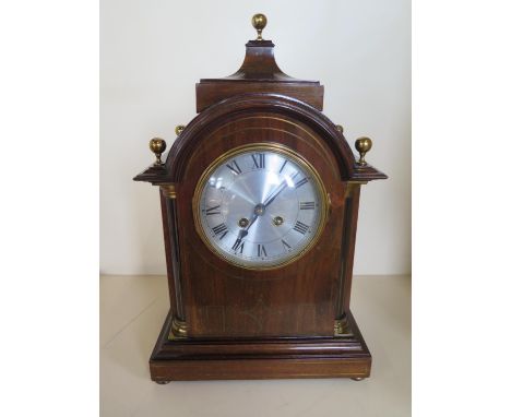 A mahogany case 8 day mantle clock, strikes hours and half 