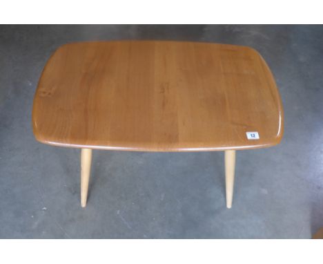 An Ercol coffee table, with Ercol label to table top underside, approximately 72cm wide, 45cm deep and 44cm high, some light 