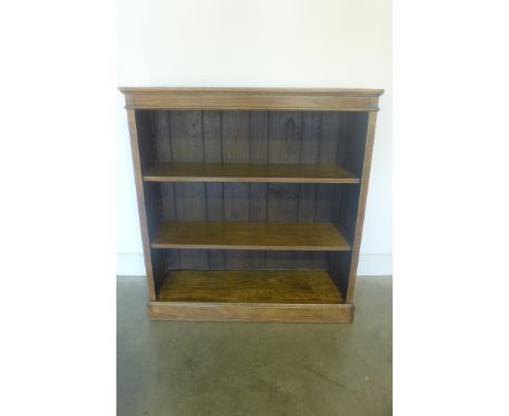 A Victorian oak adjustable shelf book case - 111cm H x 106cm x 36cm 