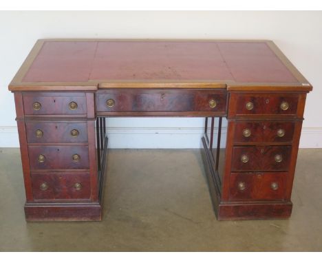 A Victorian mahogany nine drawer breakfront pedestal desk, ring pull handles with gold tooled red leather top - approx 74cm H