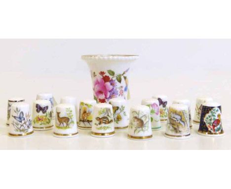 Sixteen Royal Worcester thimbles and a Royal Crown Derby Vase No condition reports for this sale