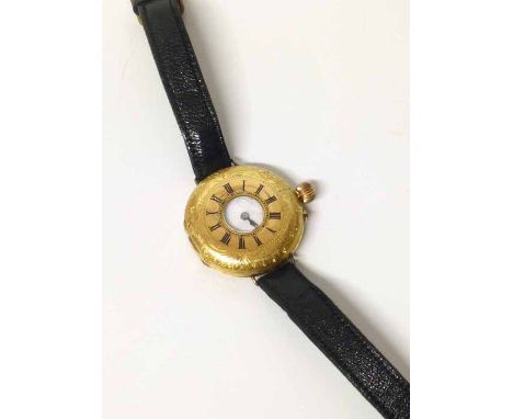 Lady's wristwatch converted from fob watch, 18ct gold half hunter style. No condition reports for this sale