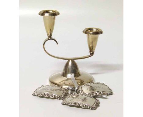 Silver candlestick together with two silver sherry labels and a port label. No condition reports for this sale