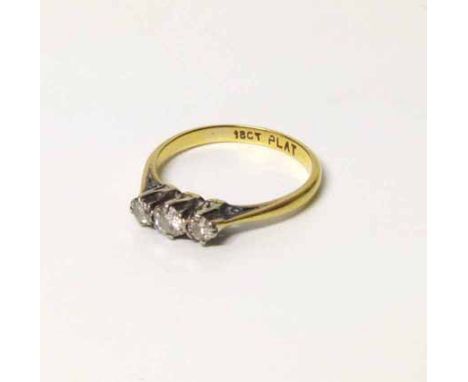 A diamond three stone 18ct gold ring, total diamond weight approximately 0.25 carot, size K. No condition reports for this sa