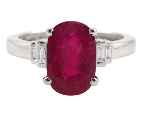 18ct gold oval ruby and baguette diamond ring, stamped 750, ruby approx 2.25 carat