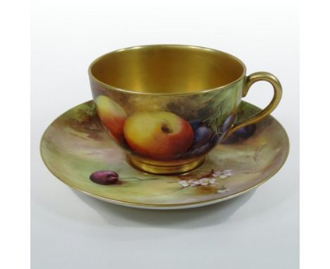 A Royal Worcester hand painted porcelain cabinet teacup and saucer, painted with fruits and berries, signed H H Price, puce m