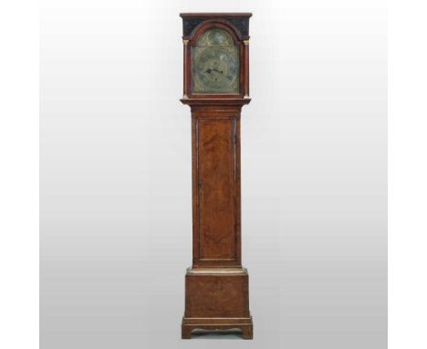 An 18th century walnut and crossbanded cased long case clock, the arched brass dial with subsidiary seconds and date aperture