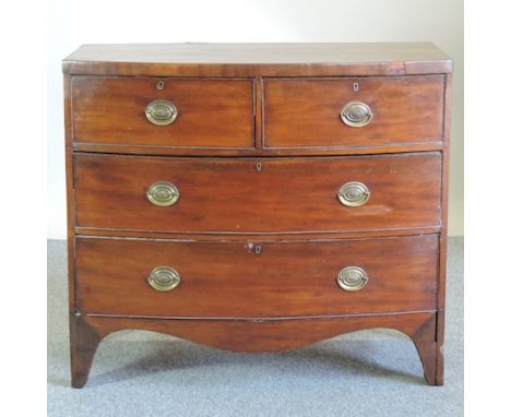A Regency mahogany bow front chest of drawers, containing two short above two long drawers on swept bracket feet, 98cm