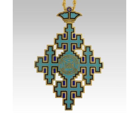 A Romanian Patriarchal Cross award, gilt metal enamelled in turquoise and black, inscribed Patriarhul Miron, Romaniei, 12cm h