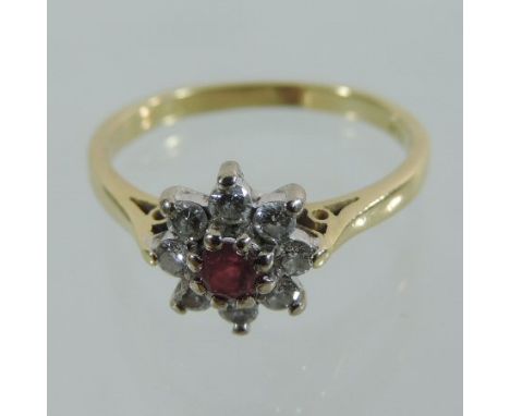 An 18 carat gold ruby and diamond cluster ring