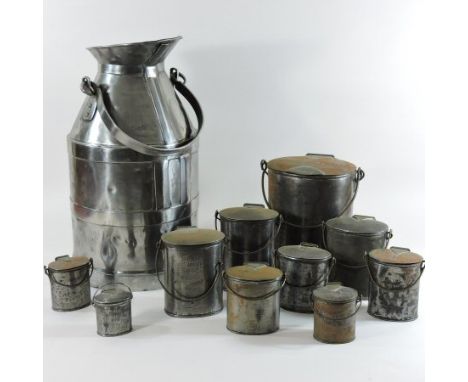 A 19th century polished steel five gallon milk jug, 52cm high, together with ten various graduated steel dairy containers, to