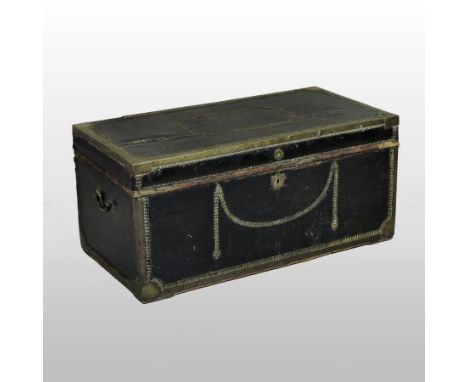 An 18th century brass studded and leather clad trunk, with a hinged lid, flanked by carrying handles, 104cm