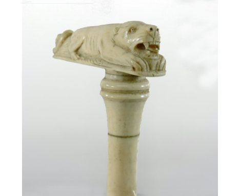 A 19th century carved ivory walking stick handle, in the form of a tiger, 33cm long