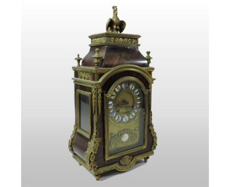 A 19th century French tortoiseshell and gilt metal mounted mantel clock, surmounted by a cockerel, bearing a plaque for Thure