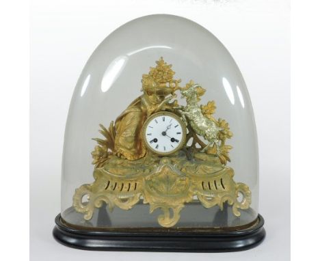 A 19th century French gilt metal mantel clock, surmounted by a lady and a goat, the white enamel dial showing Roman numerals,