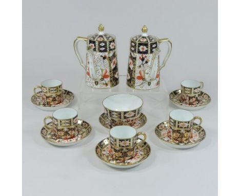 A Royal Crown Derby part coffee set, decorated in the Imari 2451 pattern, comprising five coffee cans, six saucers, a sugar b