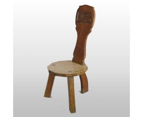 Thomas 'Gnomeman' Whitaker of Littlebeck, (d1991), circa 1960's, a light oak spinning stool, the back with an inset carved pa