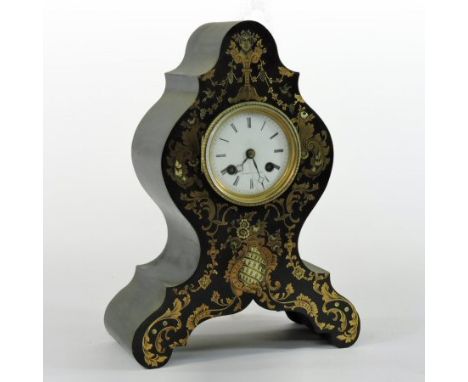 A 19th century French ebonised and cut brass decorated mantel clock, the shaped case with mother of pearl inlay, the white en