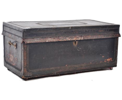 An antique early 19th Century Georgian leather and brass studded carriage trunk chest having a nailhead geometric pattern to 