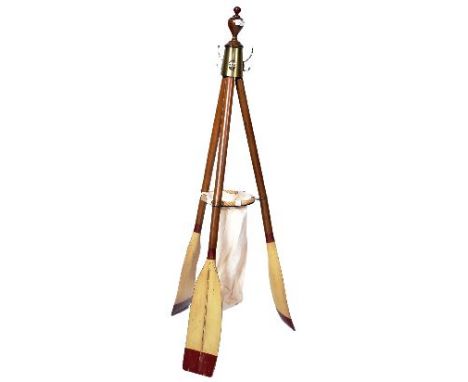 A late 20th Century coat / stick stand constructed from three rowing oars united by a turned finial atop with each oar splayi