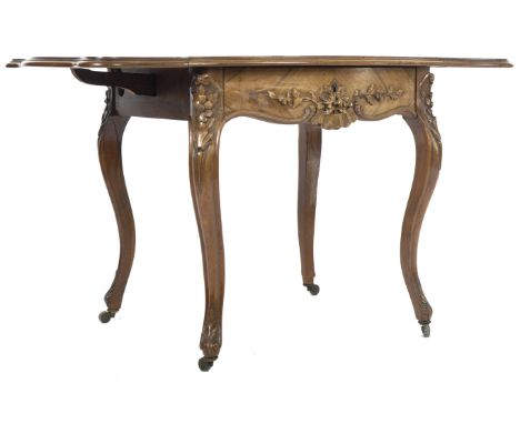 A 19th Century French kingwood sofa table / coffee occasional table of small proportions having a bowed top with quarter vene