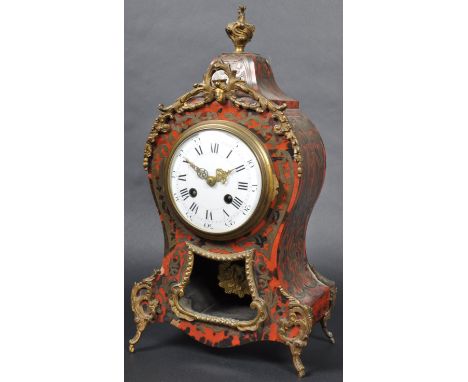 A 19th Century French Boulle Work mantel clock by Samuel Marti. The clock of shaped form with red tortoiseshell and scrolling