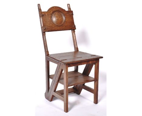 A set 19th Century Victorian metamorphic folding library steps having a shaped backrest with central carved&nbsp; panel seat.