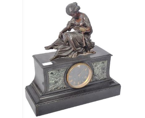 A 19th Century French black slate, marble and bronze figural mantel clock by Charles Taylor &amp; Son of Paris. Comprises a l