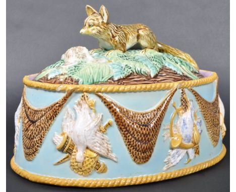 A 19th Century Victorian circa 1870, George Jones Majolica game pie dish having fox and hunting interest decoration. Turquois