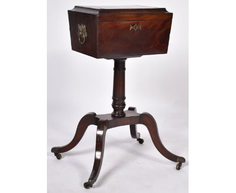An early 19th Century Scottish Regency mahogany teapoy / tea poy comprising of a large tea caddy top raised on quadruped stan