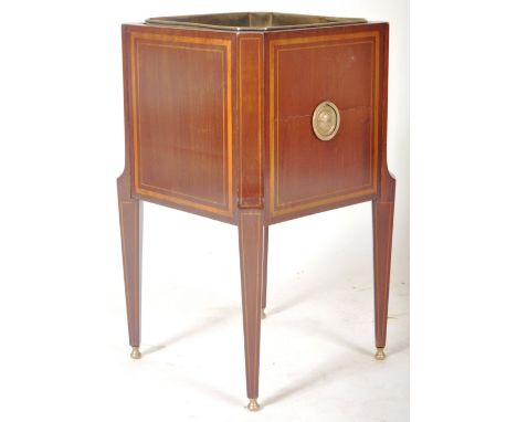 A 19th Century mahogany champagne wine cooler ice bucket having an inset brass bucket with satinwood sides inlaid with square