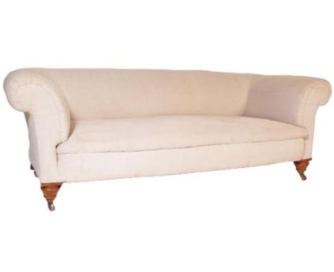 A 19th Century Victorian sofa settee in the manner of Howard &amp; Sons. The sofa having shaped sides and back with horse hai