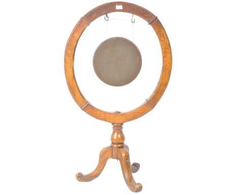 A 19th Century Victorian oak evening dinner gong having a circular carved oak frame with central hang brass circular gong. Ra