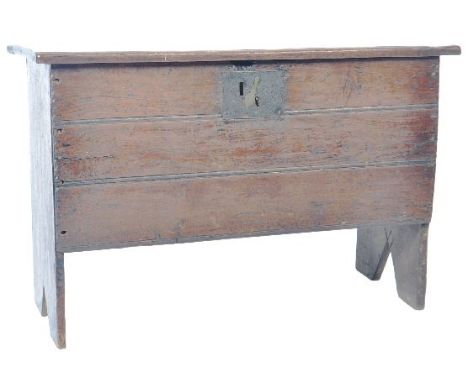 A 17th Century oak coffer mule chest box of small proportions. The box having hinged lid with ring hinges and three planks to