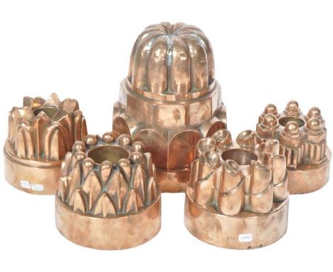 A collection of six large 19th Century Victorian copper jelly moulds. Comprises a large example stamped Postes, a ring shaped