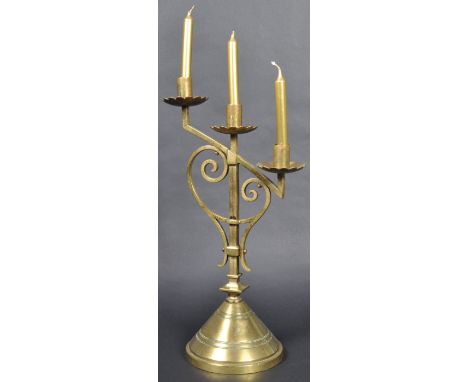 A late 19th Century Gothic Ecclesiastical polished brass candelabra in the manner of AWN Pugin for John Hardman &amp; Co. Com