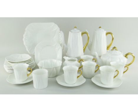 EXTENSIVE SHELLEY TEA & COFFEE SERVICE IN THE 'DAINTY' PATTERN in plain white glaze with gold detail, includes teapot, two co