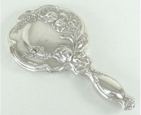 ART NOUVEAU SILVER HAND MIRROR with raised floral decoration, London 1906 Condition Report: small area of loss.There are a fe