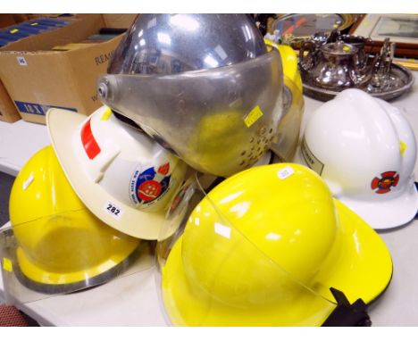 SEVEN VARIOUS FIRE BRIGADE HELMETS including New South Wales and Edmonton Fire Chief helmet (7)