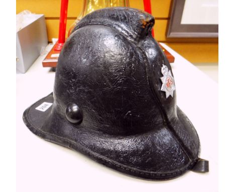 VINTAGE LEATHER BRITISH FIRE BRIGADE HELMET bearing white metal NFS badge and leather chin strap