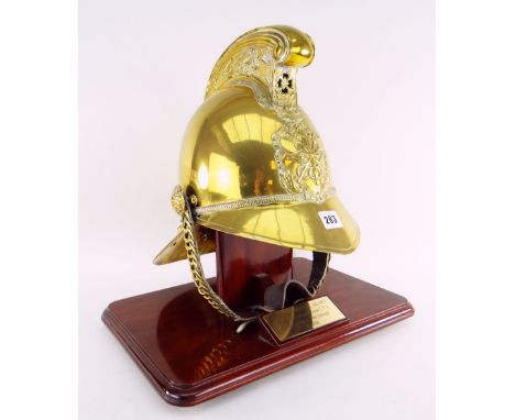 ANTIQUE BRASS MERRYWEATHER-TYPE FIRE BRIGADE HELMET on stand with plaque