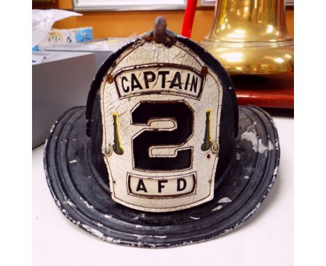 VINTAGE US FIRE FIGHTERS METAL HELMET manufactured by Cairns &amp; Bros (bearing label), the front helmet plate in leather wi